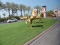 Golden horses at the entrance to a Madinat Jumeirah resort in Dubai, United Arab Emirates Royalty Free Stock Photo