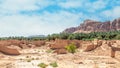 Al Ula ruined old town street with palms and rocks int the background, Saudi Arabia