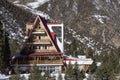 Ala-archa, Kyrgyzstan - NOV 20, 2022: Winter ski chalet in snow mountain landscape