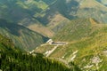Ala-Archa, Mountain camp set in remote alpine valley, surrounded by steep slopes, green ridges, and pine forests, serving as a Royalty Free Stock Photo