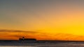 Sunset with  container ship on the horizon Royalty Free Stock Photo