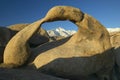 The Alabama Hills Arch framing Mount Whitney and the snowy Sierra Mountains at sunrise near Lone Pine, CA Royalty Free Stock Photo