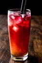 Alabama Slammer Cocktail with black straw. Royalty Free Stock Photo