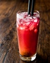 Alabama Slammer Cocktail with black straw. Royalty Free Stock Photo