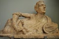 Alabaster lid of cinerary urn with a figure of a reclining man at the British Museum in London