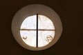 Alabaster round window with cross difussed light