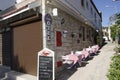 In Alacati there are cafes, covered and food menues in front of the hotels Royalty Free Stock Photo