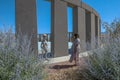 ALAMO, NEVADA, UNITED STATES - Jun 07, 2020: A woman photographs an alien at Stonehenge Replica monument