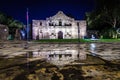 The Alamo in San Antonio, Texas during night after a rainfall wi