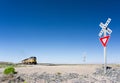 Alamogordo, NM / United States - July 10, 2016: Union Pacific freight train crosses a railroad crossing in the New Mexico desert o Royalty Free Stock Photo