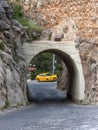 Alanya, Turkey - Apr 26, 2023. The yellow taxi is parked near the tunnel