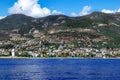 Alanya Turkey coastline panorama - view from Mediterranean Sea. I love Alanya sign on the hillside and a lighthouse in the water Royalty Free Stock Photo