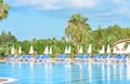 Alanya, Turkey - June15, 2021: Pool area in luxury modern hotel with sunbeds and palm trees. Morning at the vacation place Royalty Free Stock Photo