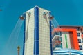 Shower near the pool against the blue sky. Tourists can pour water on a hot summer day. People can wash their feet from the sand, Royalty Free Stock Photo