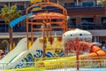 Water park and outdoor pool on a hot summer day. Entertainment on the water and water slides is a Royalty Free Stock Photo