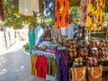 Alanya, Turkey - Nov 3, 2022. A colorful array of bags and pieces of clothes, meticulously arranged on the wooden shelves of an