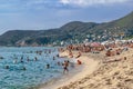 Lots of adults and children on Kleopatra beach in Alanya. People swim in the Mediterranean Sea