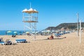 Rescue tower at Kleopatra Beach in Alanya. Beautiful tropical landscape with sun loungers,