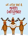 `We wish you a Merry Christmas` - Singing reindeers. Royalty Free Stock Photo