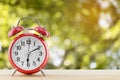 Alarm clock with abstract nature bokeh blur background Royalty Free Stock Photo