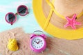 Alarm clock with beach hat Royalty Free Stock Photo