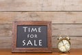Alarm clock and blackboard with text `Time for sale Royalty Free Stock Photo