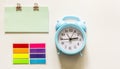 Alarm clock with blank note and colored stickers Royalty Free Stock Photo