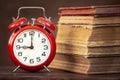 Alarm clock and books, back to school, morning wake up concept