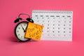 Alarm clock, calendar and reminder note with phrase Don`t forget on pink Royalty Free Stock Photo