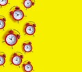 Alarm clock on a colored background concept pattern morning