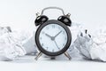 Alarm clock with crumpled paper balls.Timing and thinking idea concept Royalty Free Stock Photo