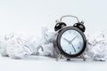 Alarm clock with crumpled paper balls.Timing and thinking idea concept Royalty Free Stock Photo