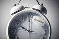 Alarm clock with deadline note concept for business time management and urgency Royalty Free Stock Photo