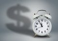 Alarm clock with dollar shadow, time is money concept Royalty Free Stock Photo