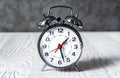 Alarm clock at empty locker on white background