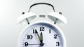 Alarm clock face beginning of time 11.56 on white backgroundÃ Â¹Æ Royalty Free Stock Photo
