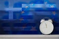 Alarm Clock in Front of Greece and European Union Painted Wall Royalty Free Stock Photo