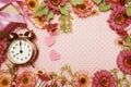 Alarm clock and gift box with roses bouquet with space copy on pink polka dot background Royalty Free Stock Photo