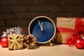 Alarm clock with gifts on table. Christmas countdown Royalty Free Stock Photo