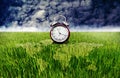 Alarm clock and green rice field with world map overlay, Time to plantation Royalty Free Stock Photo