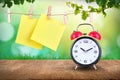 Alarm clock and hanging note on clothesline Royalty Free Stock Photo