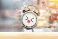 The alarm clock is happy in the morning at the bedroom. Royalty Free Stock Photo