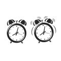 Alarm clock icons standing and ringing wake-up time isolated on white background. Retro style cartoon clock. Royalty Free Stock Photo