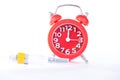 Alarm clock and injection syringe show medicine time