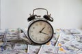 Alarm clock on money banknotes Dollars,concept of business planning and finance. Usurer, credit concept. Time for quick money. Royalty Free Stock Photo