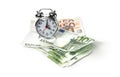 Alarm clock and money on white Royalty Free Stock Photo