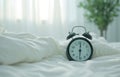 Alarm clock in the morning bedroom Royalty Free Stock Photo