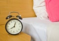 alarm-clock in morning bedroom Royalty Free Stock Photo