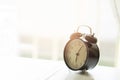 Alarm clock in the morning bedroom. Royalty Free Stock Photo