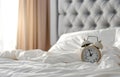 Alarm clock in the morning bedroom Royalty Free Stock Photo